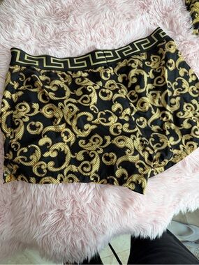 Versace Black and Gold Swim shorts. Matching top available.